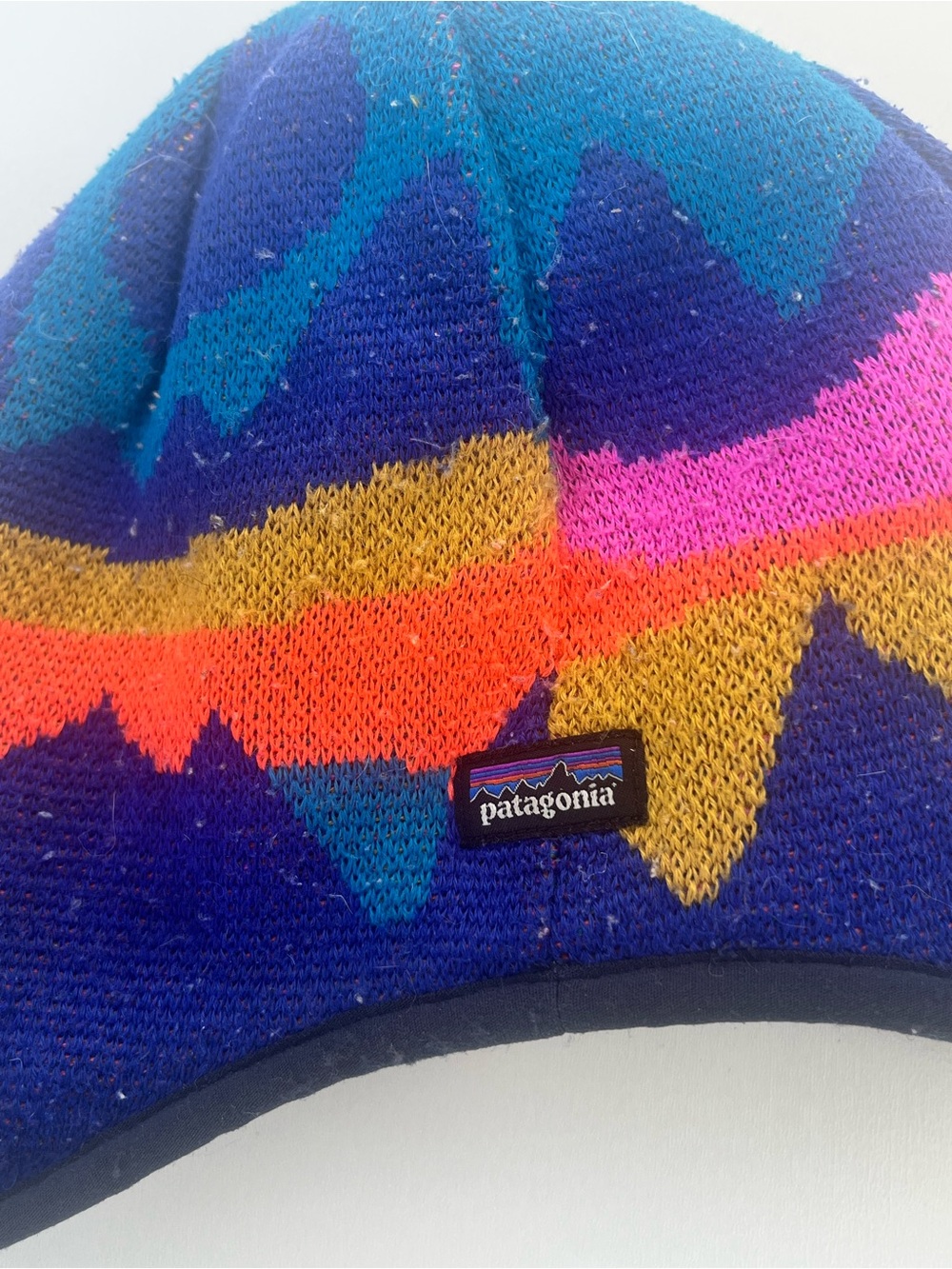 Patagonia Blue Beanie with Multicolor Zigzag Pattern